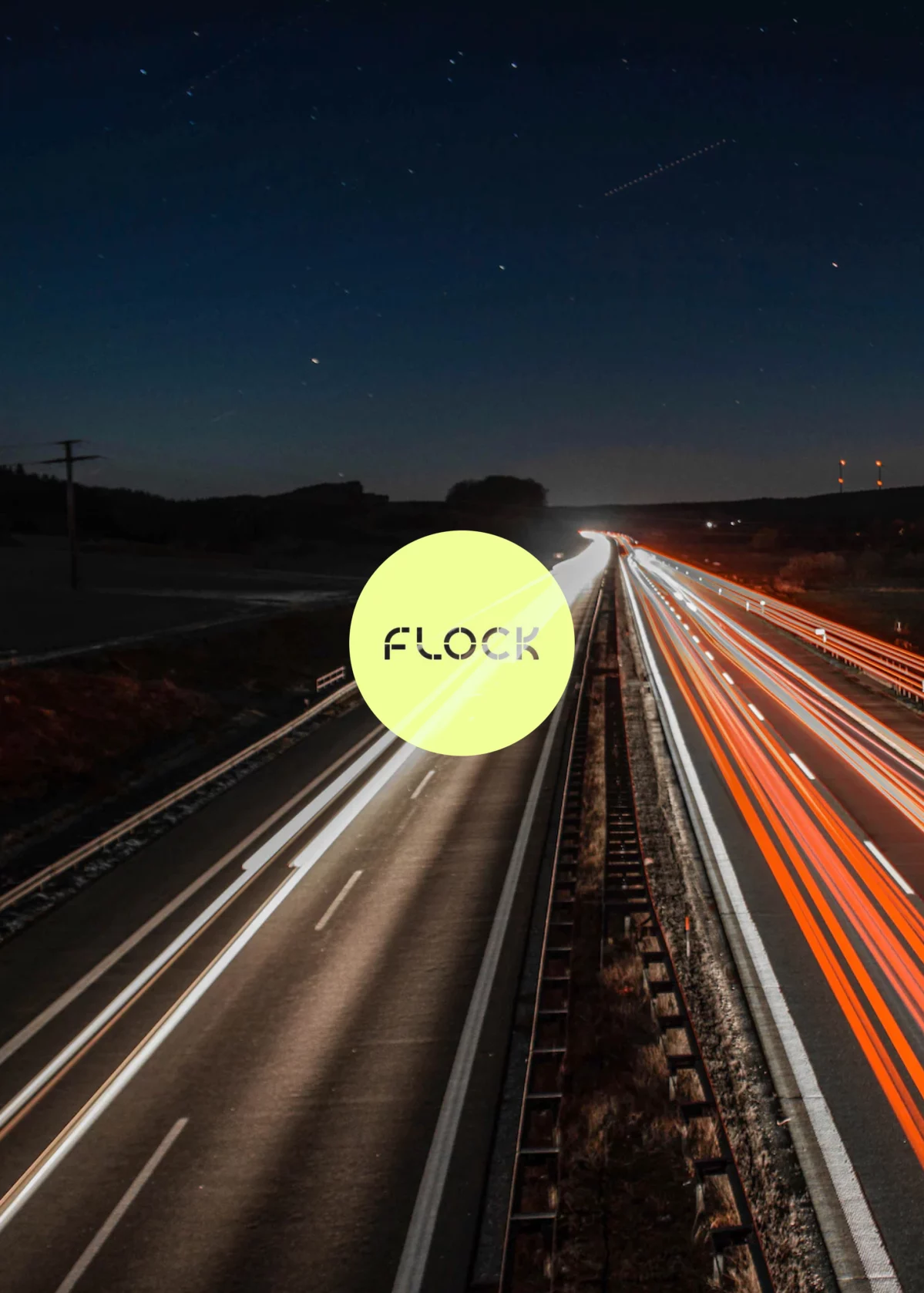 Company logo of Flock Freight with a busy highway in the background