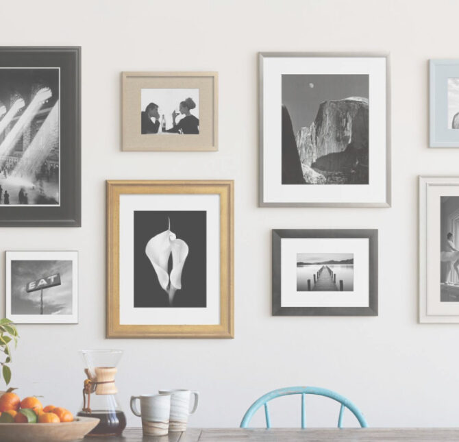 Framed pictures on a white wall