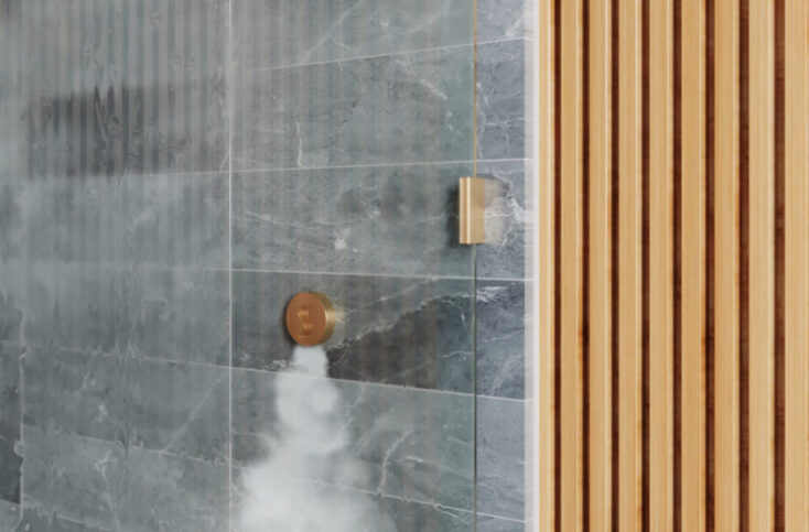 A shower with ThermaSol's SteamVection steamhead in gold