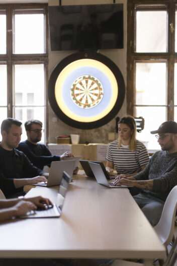 Team members of web development agency having a meeting in the office