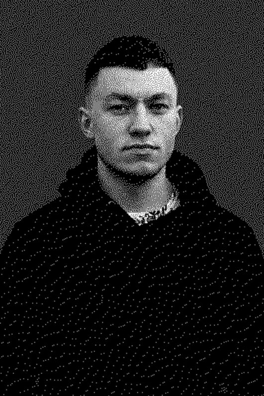 Black-and-white portrait of a man in a hoodie.